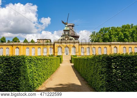 New Chambers (neue Kammern) Palace And Windmill (windmuhle) In  Sanssouci Park In Spring, Potsdam, G