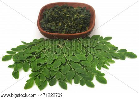 Moringa Leaves Fresh And Dired Over White Background
