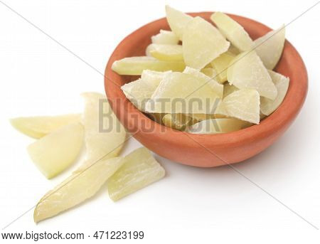 Sliced Amla Fruits In A Bowl Over White Background