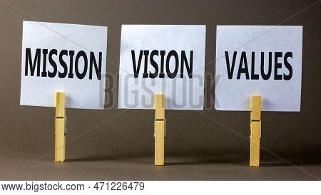 Mission Vision Values Symbol. Concept Words Mission Vision Values On White Paper On Clothespin On A 