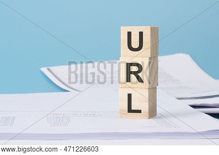 Url - Financial Concept, Wooden Cubes On Blue Background