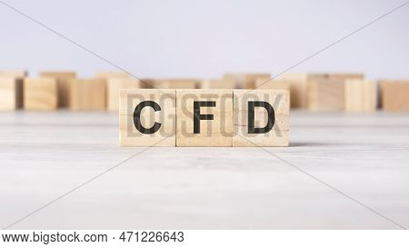 Cfd - Word Concept Written On Wooden Cubes Or Blocks On A Light Background