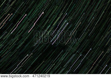 Traces Of Stars And Planets In Night Sky. Luminous Tracks Of Movement Of Celestial Bodies. Abstract 