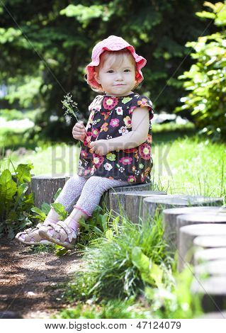 A Child On A Little Tree Stump