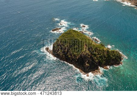 Aerial Drone Of Waves Crashing On A Rocky Island. Santa Ana, Cagayan. Philippines.