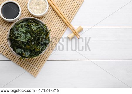 Fresh Laminaria (kelp) Seaweed Served On White Wooden Table, Flat Lay. Space For Text