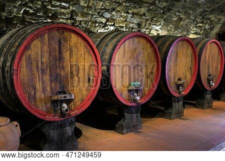 Chianti Wine From Sangiovese Grapes Aging In Wooden Barrels At A Vineyard In The Famous Wine Produci