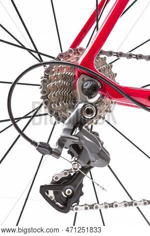 Road Cycling Ideas. Closeup Of Rear Derailier And Rear Cassette With New Chain Against White.