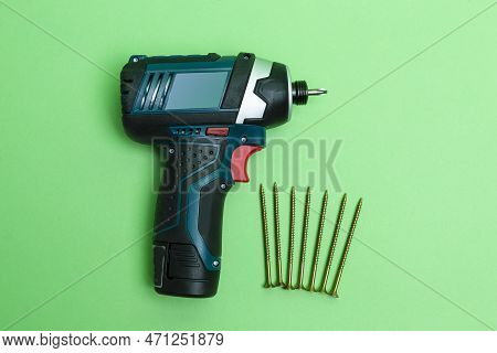 Cordless Combi Drill As Impact Drill And Screw Driver Placed Together With Line Of Metal Self-tappin