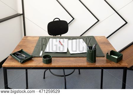 Empty Workplace With Documents On The Table