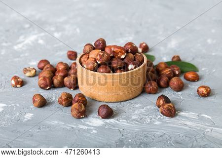 Wooden Bowl Full Of Hazelnuts On Table Background. Healthy Eating Concept. Super Foods.
