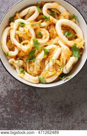 Calamares Encebollados Is A Traditional Spanish Dish Made With A Squid, Onions, Garlic, Olive Oil, W