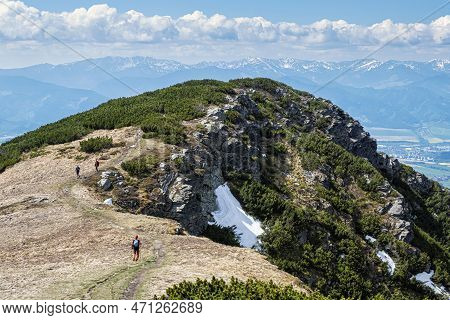 Hikers Are Walking In Western Tatras, Slovak Republic. Hiking Theme. Seasonal Natural Scene.