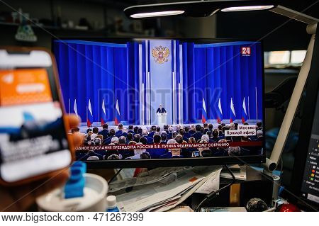 Paris, France - Feb 21, 2023: Creative Room Man Watching On Pc Krym 24 Station Direct Stream As Russ