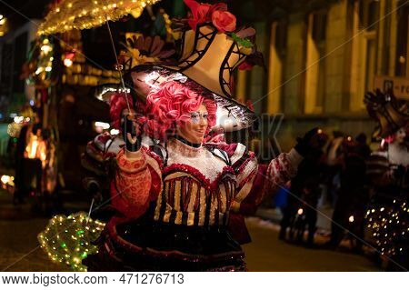 Aalst, Belgium, 19 February 2023: Brightly Illuminated Carnival Dancer Participating In Aalst Mardi 