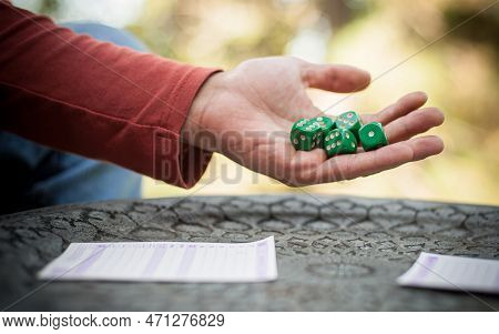 Two Friends, Men And Women Are Playing Yamb Game In Their Free Time In The  Spring Garden