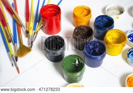 For Artists, There Are A Lot Of Colored Paints And Brushes. Watercolor Paints Next To The Brushes. P