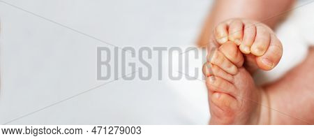 Baby Feet Close Up On White Background