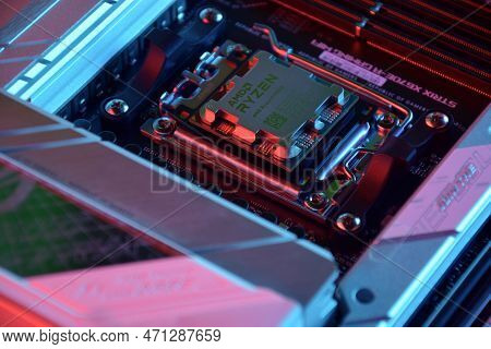 Close-up Of An Amd Ryzen 9 7900X Processor Installed On A Motherboard Asus Rog Strix X670E