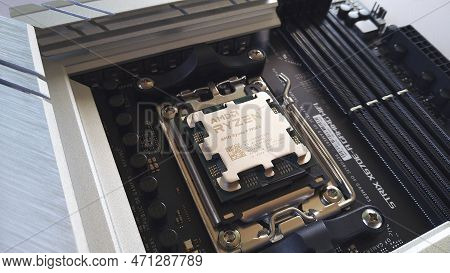 Close-up Of An Amd Ryzen 9 7900X Processor Installed On A Motherboard Asus Rog Strix X670E