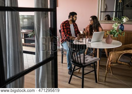 Serious Wife And Husband Planning Budget, Checking Finances, Focused Young Woman Using Online Calcul