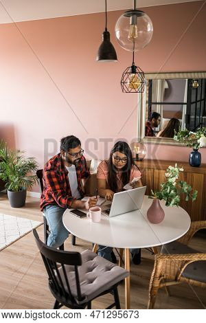 Serious Wife And Husband Planning Budget, Checking Finances, Focused Young Woman Using Online Calcul