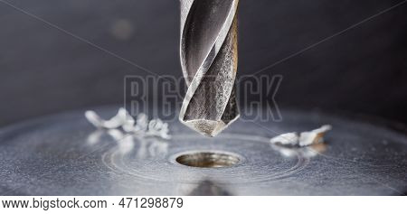 Metal Drill Bit Make Holes In Steel Billet On Industrial Drilling Machine. Metal Work Industry. Mult