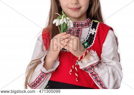 Bulgarian Girl In Traditional Folklore Costumes With Spring Flowers Snowdrop And Handcraft Wool Brac