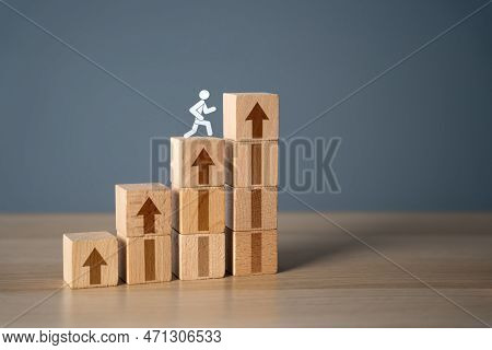 Man Climbs The Stairs To Success. Movement Towards The Goal. Step By Step. New Opportunities. Get To