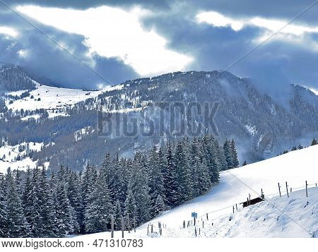 Beautiful Low Winter Clouds And Fog Condensation In The Swiss Alps Above The Tourist Resorts Of Valb