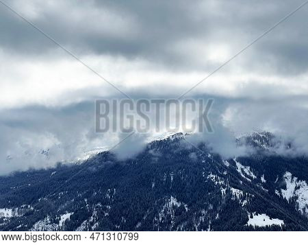 Beautiful Low Winter Clouds And Fog Condensation In The Swiss Alps Above The Tourist Resorts Of Valb