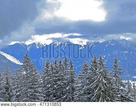 Beautiful Low Winter Clouds And Fog Condensation In The Swiss Alps Above The Tourist Resorts Of Valb