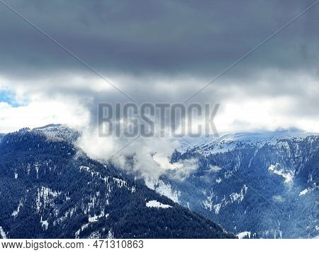 Beautiful Low Winter Clouds And Fog Condensation In The Swiss Alps Above The Tourist Resorts Of Valb