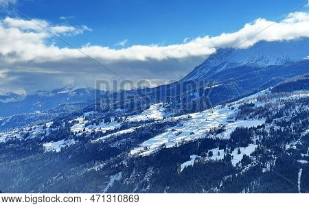 Beautiful Low Winter Clouds And Fog Condensation In The Swiss Alps Above The Tourist Resorts Of Valb