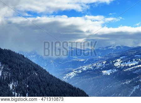 Beautiful Low Winter Clouds And Fog Condensation In The Swiss Alps Above The Tourist Resorts Of Valb