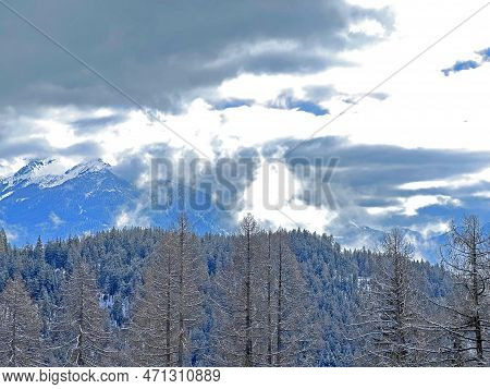 Beautiful Low Winter Clouds And Fog Condensation In The Swiss Alps Above The Tourist Resorts Of Valb