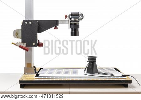 Horizontal Side Shot Of A Camera On A Copy Stand Ready To Copy Old 35mm Slides.  On The Copy Stand I