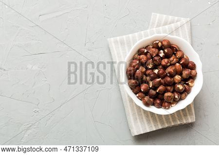 Wooden Bowl Full Of Hazelnuts On Table Background. Healthy Eating Concept. Super Foods.