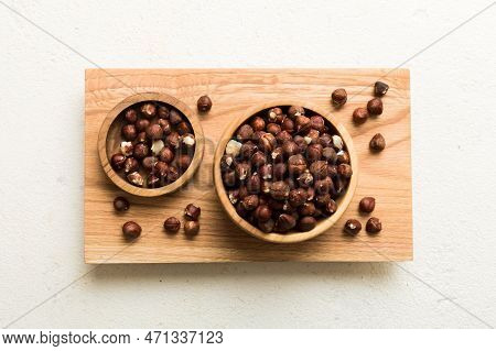 Wooden Bowl Full Of Hazelnuts On Table Background. Healthy Eating Concept. Super Foods.