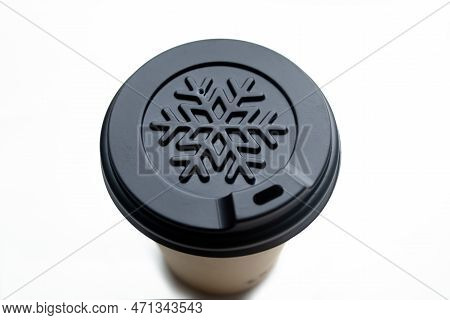 Plastic Cup On A White Background. On The Lid Of A Paper Cup, A Snowflake Is A Winter Design. A Cup