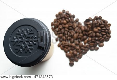 A Winter Cup On A White Background, Next To A Heart Of Coffee Beans. The Love Of Coffee Is Heart And