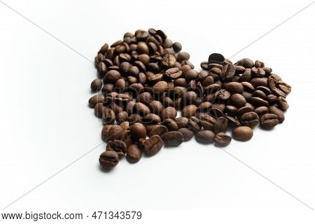 The Heart Is Lined With Coffee Beans. On A White Background, A Heart Of Coffee Beans. Love Of Coffee