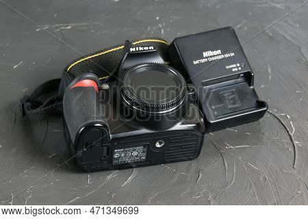 Ukraine, Chernihiv, February 21, 2023: Old Used Photo Equipment, Old Nikon Camera And Charger On A G