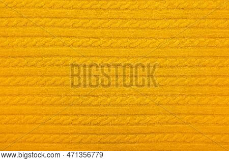 Close Up Background Texture Of Warm Yellow Cable Knitted Wool Jersey Fabric Sweater With Row Braid P