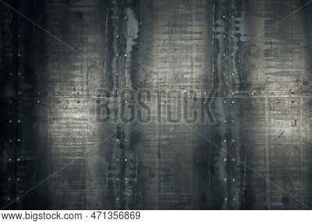 Grunge Rusty Damaged Weathered Steel Metal Panels Wall With Bolt Heads Or Rivets, Background Texture