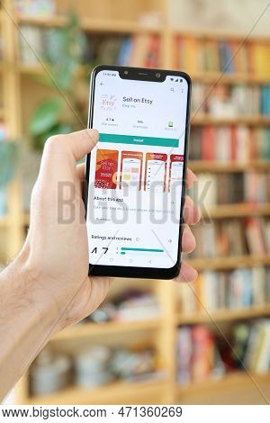 Warsaw, Poland - January 29, 2021: User Installing Sell On Etsy Craft Shopping Mobile App On An Andr