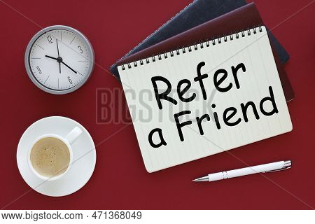 Refer A Friend. Red Background Cup Of Coffee Notepad Page With Text