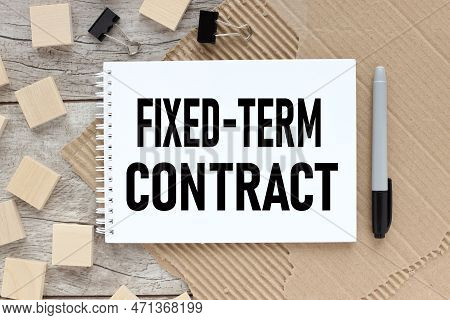 Top View Clock And Miniature People With Text Fixed-term Contract On A White Puzzle Background