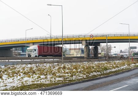 Trucks And Cars Drive Under The Transport Bridge. Transport Logistics.