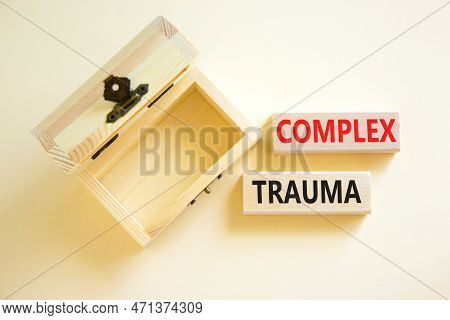 Complex Trauma Symbol. Concept Words Complex Trauma On Wooden Block. Beautiful White Table White Bac